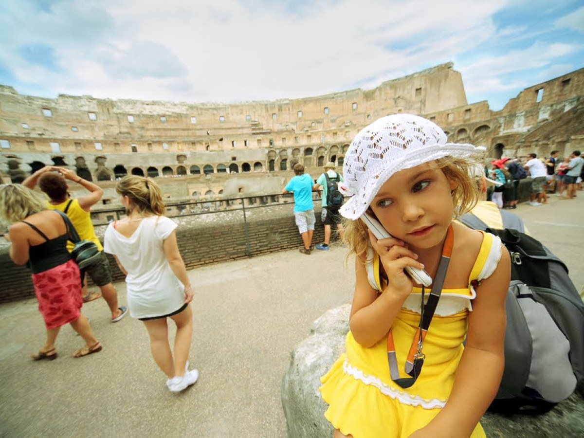 a little girl wearing a hat
