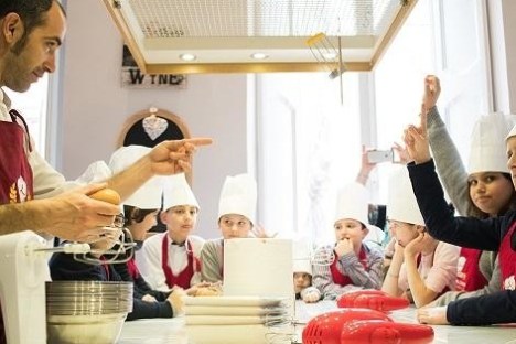 a group of people in a kitchen
